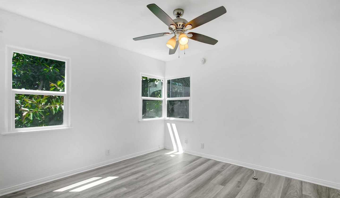 Bright bedroom with a ceiling fan