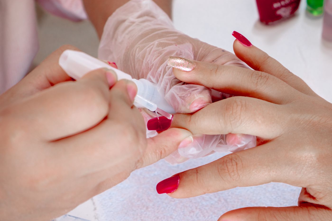 Glossy red manicure at Lacquer & Light nail studio