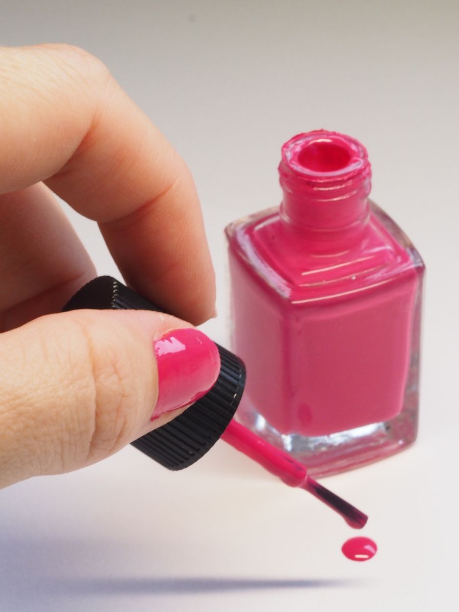 Pink polish bottle and brush